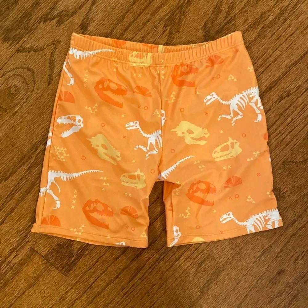 NWOT boys or girls swim shorts size 152 which is an 11/12 - dinosaurs, orange